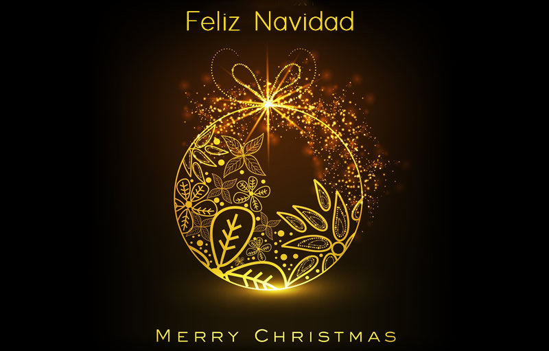  Imagen de un adorno de Navidad decorado y brillante con deseos de felices fiestas en español e inglés 